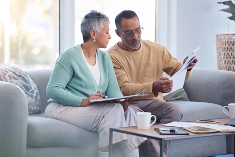 couple reviewing home maintenance checklist
