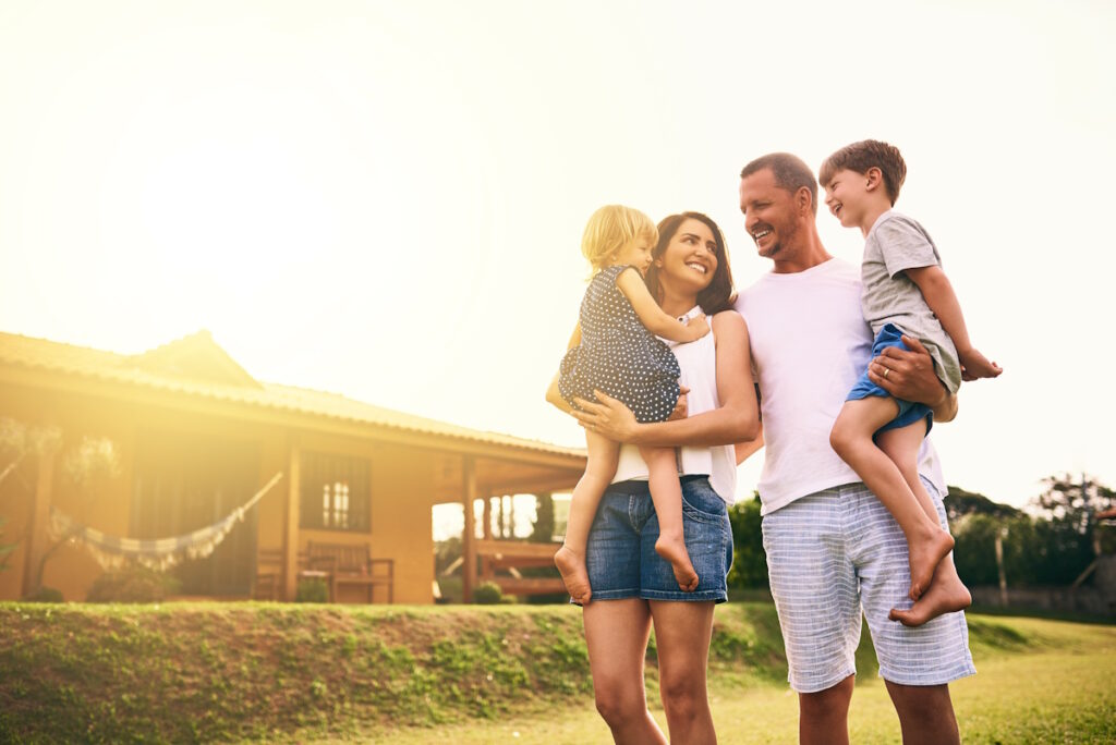 family outside home in spring